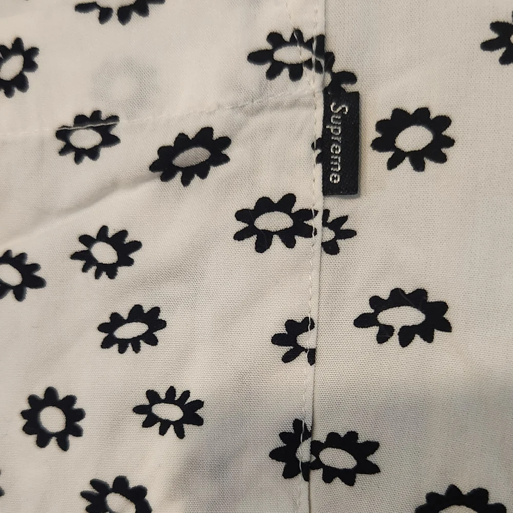 Supreme casual button